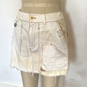 Low waist distressed and patched free people denim mini skirt, military deets
